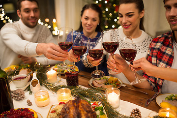 Image showing close up of friends with wine celebrate christmas