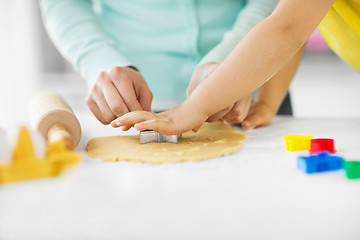 Image showing mother and daughter making cookies at home