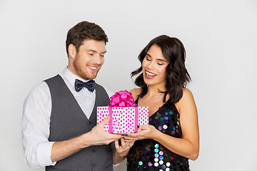 Image showing happy couple with gift box at birthday party