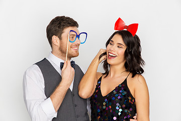 Image showing happy couple with party props having fun