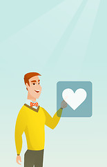 Image showing Young man pressing heart shaped button.