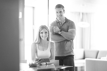 Image showing couple using tablet at home