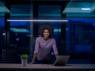 Image showing black businesswoman using a laptop in startup office