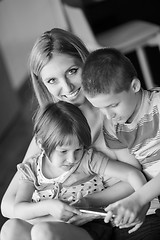 Image showing Young Family Using A Tablet To Make Future Plans