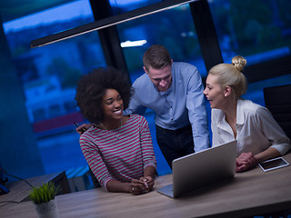 Image showing Multiethnic startup business team in night office