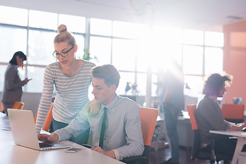 Image showing Two Business People Working With laptop in office