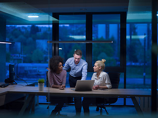 Image showing Multiethnic startup business team in night office