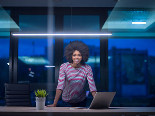 Image showing black businesswoman using a laptop in startup office