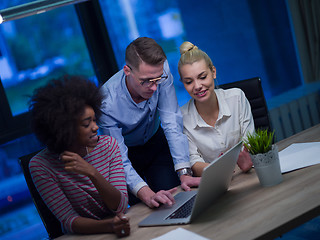 Image showing Multiethnic startup business team in night office