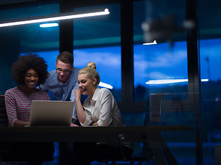 Image showing Multiethnic startup business team in night office