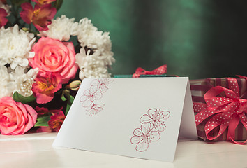 Image showing Love background with pink roses, flowers, gift on table