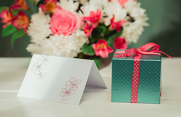 Image showing Love background with pink roses, flowers, gift on table