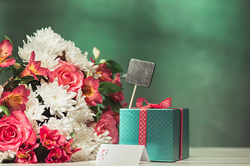 Image showing Love background with pink roses, flowers, gift on table