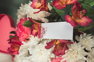 Image showing Love background with pink roses, flowers, gift on table