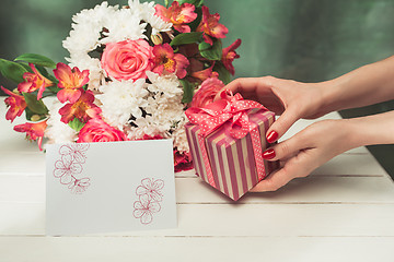 Image showing Love background with pink roses, flowers, gift on table