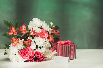 Image showing Love background with pink roses, flowers, gift on table