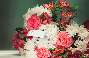 Image showing Love background with pink roses, flowers, gift on table