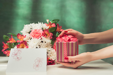 Image showing Love background with pink roses, flowers, gift on table