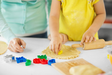 Image showing mother and daughter making cookies at home