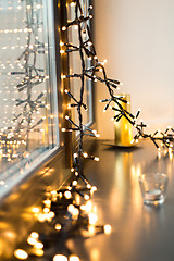 Image showing close up of christmas garland on window sill