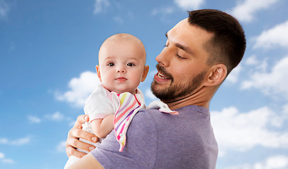 Image showing father with little baby girl at home