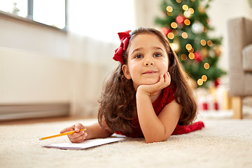 Image showing little girl making christmas wish list at home