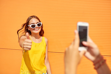 Image showing teenage girl photographing friend by smartphone