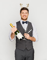 Image showing man with bottle of champagne at christmas party