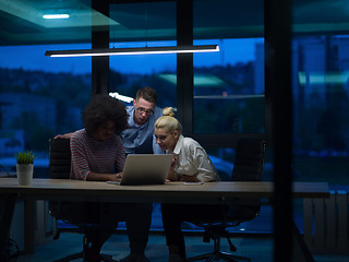 Image showing Multiethnic startup business team in night office