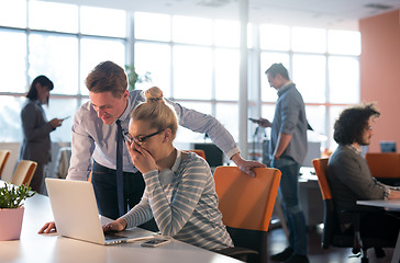 Image showing Two Business People Working With laptop in office