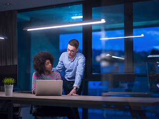 Image showing Multiethnic startup business team in night office