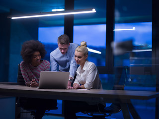 Image showing Multiethnic startup business team in night office