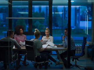 Image showing Multiethnic startup business team in night office