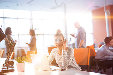 Image showing Young businesswoman using computer at work