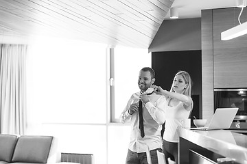 Image showing A young couple is preparing for a job and using a laptop