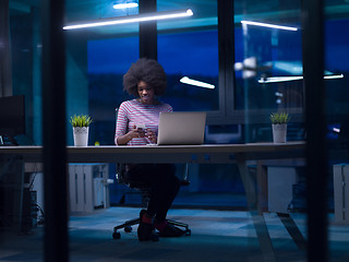 Image showing black businesswoman using a laptop in startup office