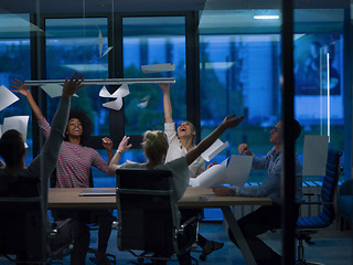 Image showing multiethnic Group of young business people throwing documents