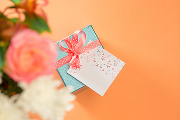 Image showing Love background with pink roses, flowers, gift on table