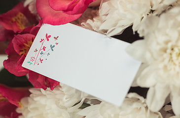 Image showing Love background with pink roses, flowers, gift on table