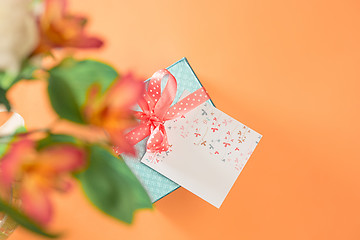 Image showing Love background with pink roses, flowers, gift on table