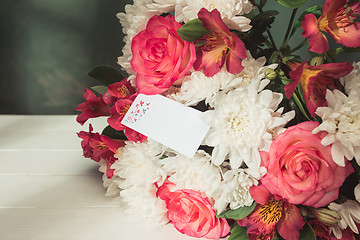 Image showing Love background with pink roses, flowers, gift on table