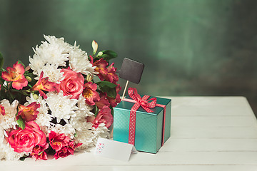 Image showing Love background with pink roses, flowers, gift on table