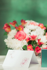 Image showing Love background with pink roses, flowers, gift on table