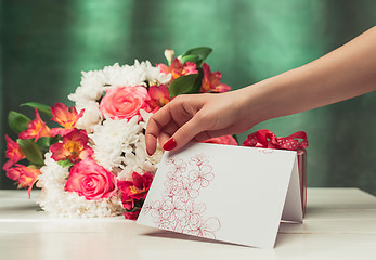 Image showing Love background with pink roses, flowers, gift on table