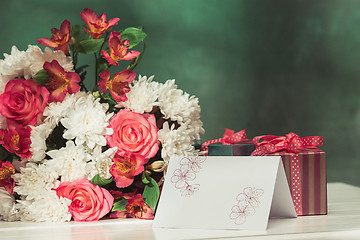 Image showing Love background with pink roses, flowers, gift on table