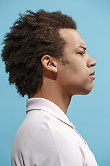 Image showing Beautiful bored afro man isolated on blue background