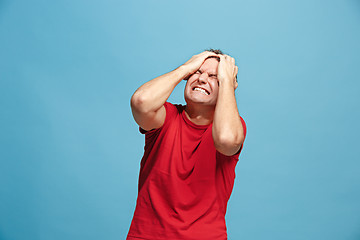 Image showing Handsome man in stress isolated on blue