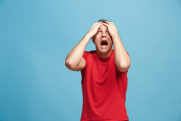 Image showing Handsome man in stress isolated on blue