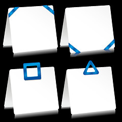 Image showing Set of sheets of paper as note pads with  blue barrettes