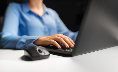 Image showing close up of female hands with laptop and mouse